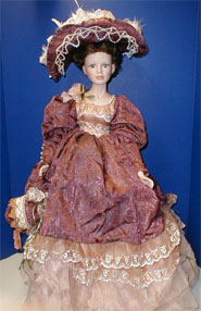 Porcelain Doll with Mauve Dress